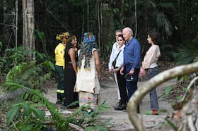 President Joe Biden tours a portion of the Amazon rainforest Sunday with his daughter, Ashley Biden, third from right, and granddaughter Natalie Biden, right.